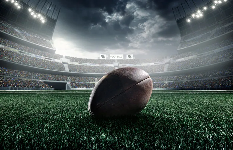 Football placed on a football field